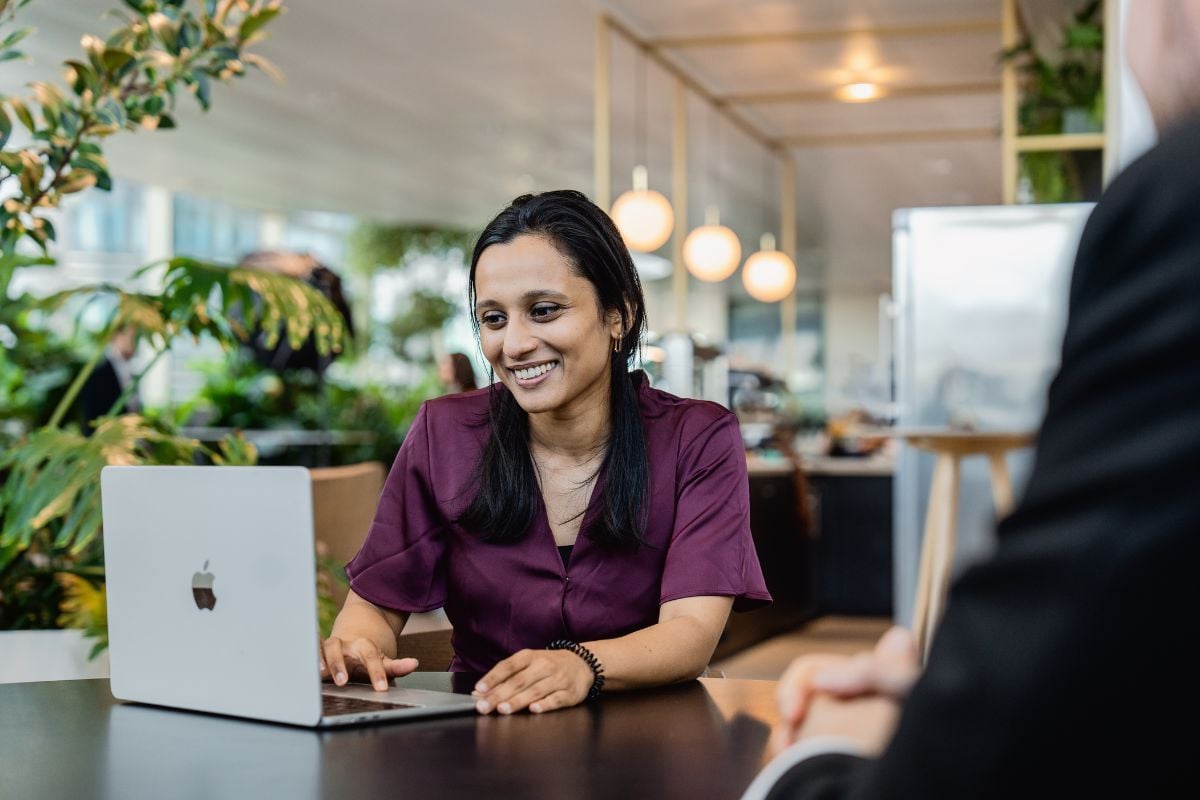 Woman smiling working RiskSphere